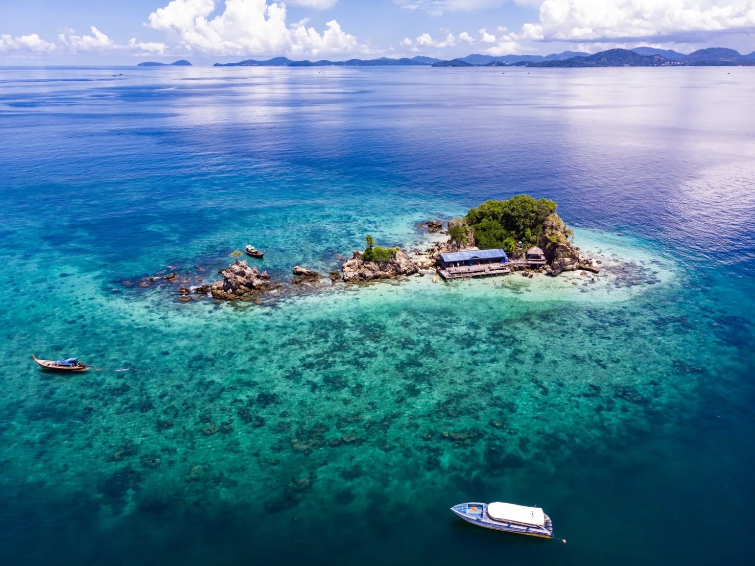 Speedboat tour to Phi Phi Island, Maya Bay, and Khai Island by YoPhuket, a one-day trip.
